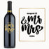A wine bottle with August 12 & Mr & Mrs 2024 engraved in bold black and gold script on the label.