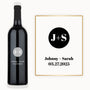 A wine bottle labeled with J+S Johnny + Sarah 03.27.2025 in black and white Modern Circle Initials style.