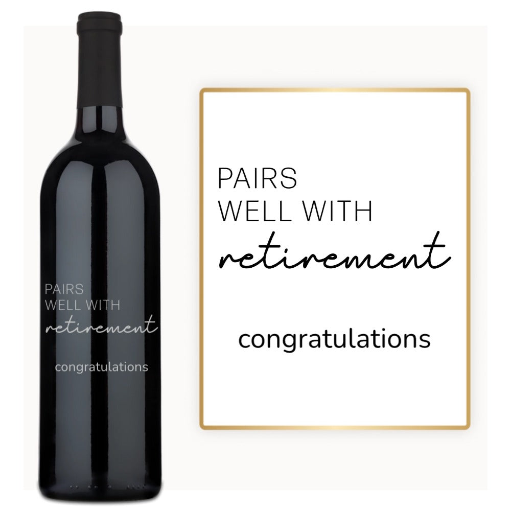 A custom engraved wine bottle labeled Pairs Well With Retirement next to a matching decorative sign.