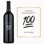 A wine bottle engraved with Keep It 100 next to a matching card, both arranged as a birthday gift set.