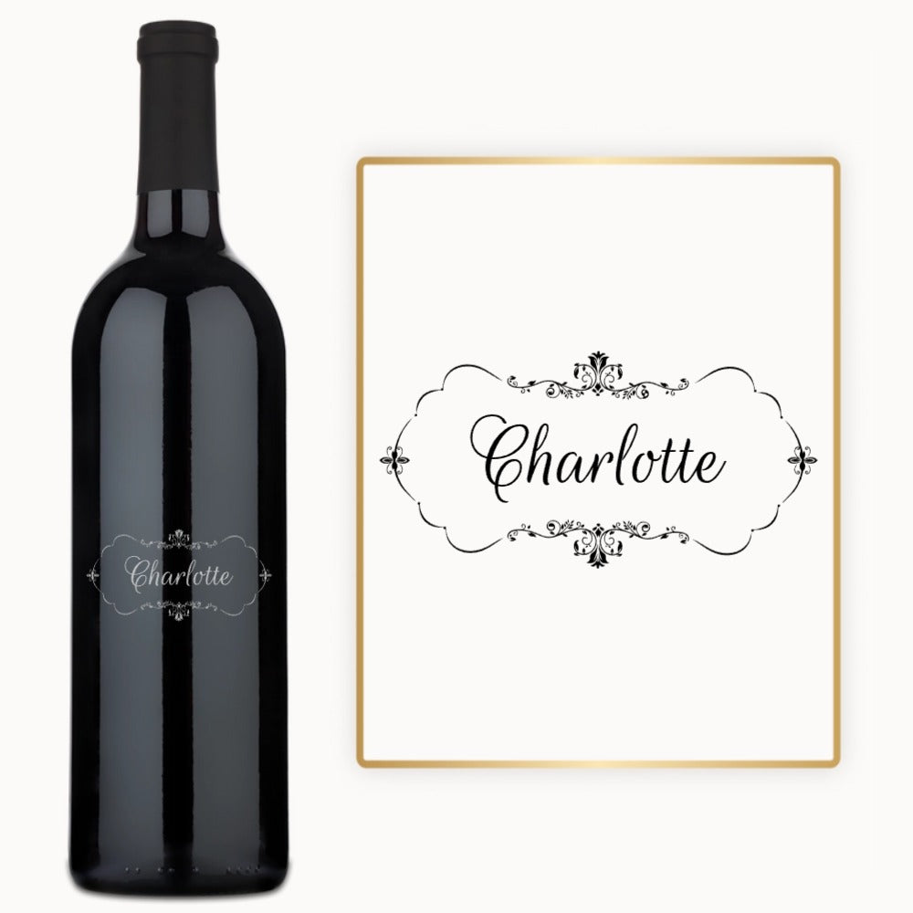 Decorative monogram frame and engraved wine bottle, both labeled Charlotte with floral script accents.