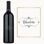 Decorative monogram frame and engraved wine bottle, both labeled Charlotte with floral script accents.