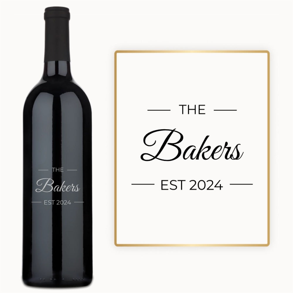 Custom wine bottle engraved with The Bakers EST 2024 in elegant black and gold script.