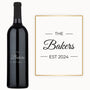 Custom wine bottle engraved with The Bakers EST 2024 in elegant black and gold script.