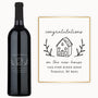 Custom engraved wine bottle labeled Welcome Home with the address 1104 Pine Ridge Rd featured on the design.