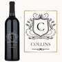 A wine bottle and card feature a Heritage Shield Monogram engraved with the letter C and the name COLLINS.