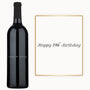 A wine bottle with custom engraving and a Happy 19th Birthday card beside it.