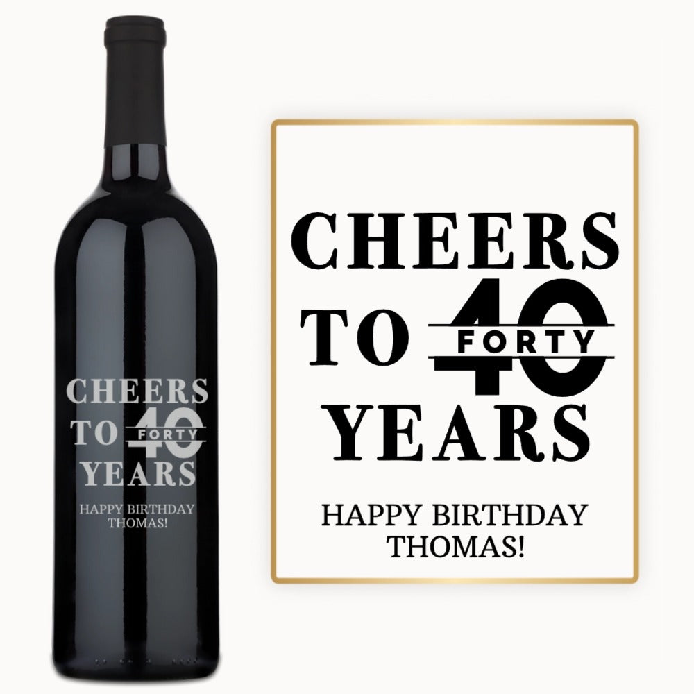 A wine bottle with Happy Birthday Thomas engraved in bold black letters.