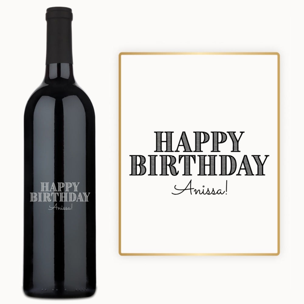 A custom engraved wine bottle and card, both displaying HAPPY BIRTHDAY Anissa in bold letters.