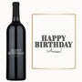 A custom engraved wine bottle and card, both displaying HAPPY BIRTHDAY Anissa in bold letters.