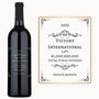 A bottle of wine with an engraved label reading Executive Achievement, presented as a corporate gift.