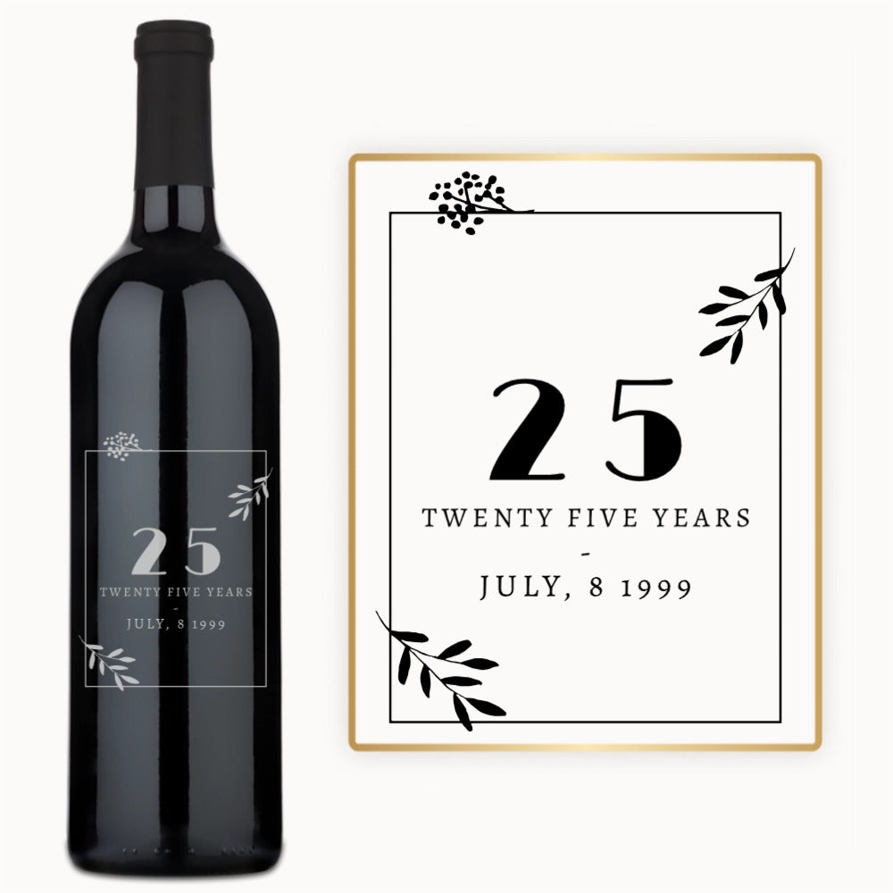 A wine bottle with 25 years - July 8, 1999 engraved, framed by black leaves on the label.