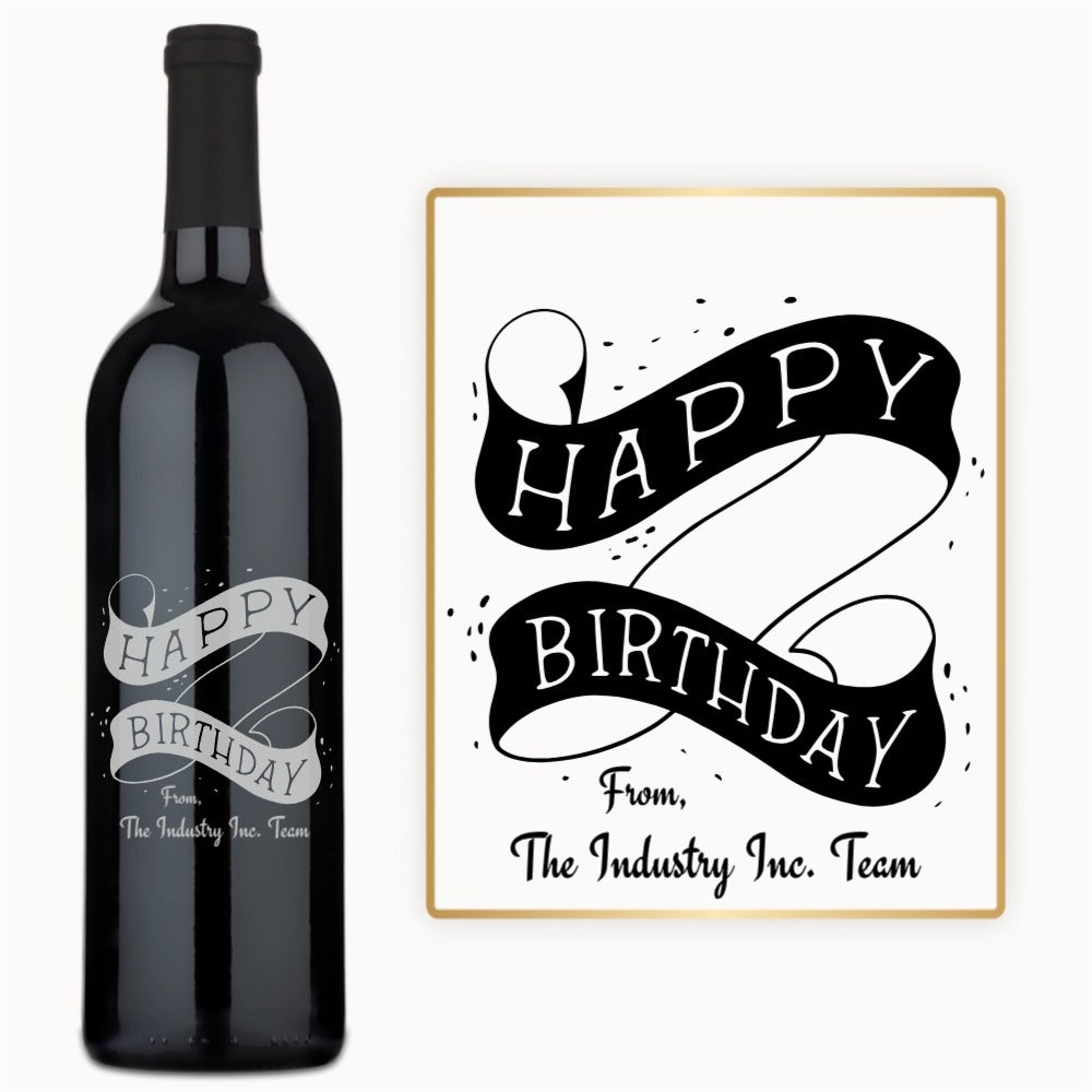 Engraved wine bottle with Happy Birthday scroll, black ribbon, and a card from The Industry Inc. Team.