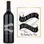 Engraved wine bottle with Happy Birthday scroll, black ribbon, and a card from The Industry Inc. Team.