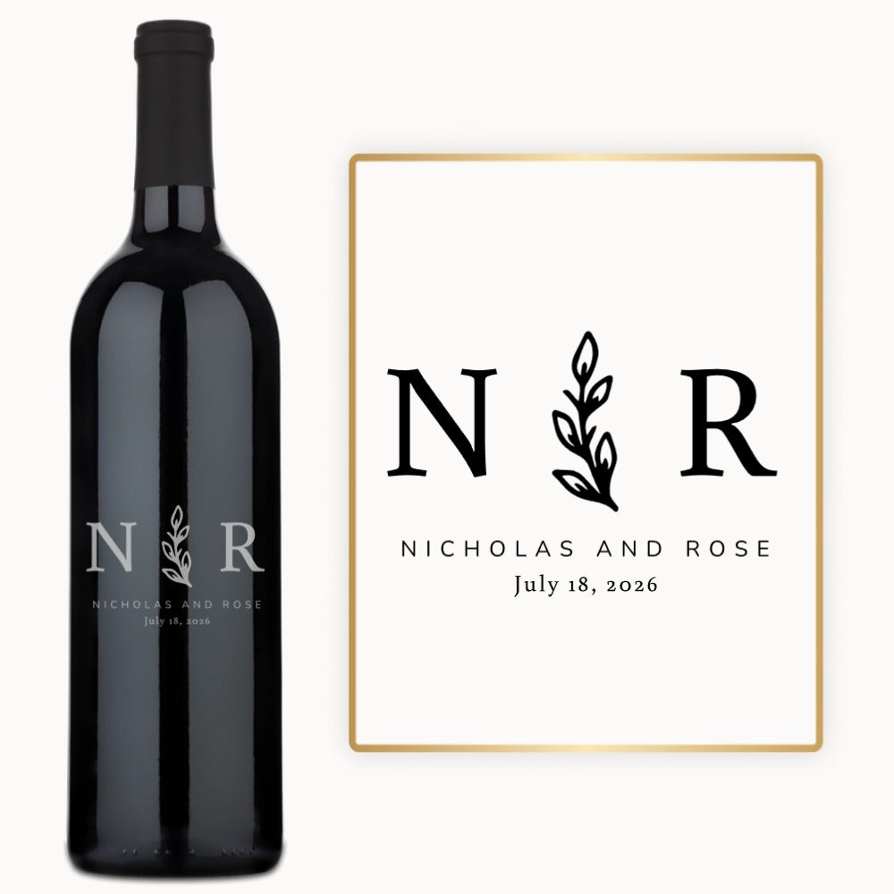 Custom wine bottle engraved with initials N R, olive branch motif, and Nicholas & Rose, July 18, 2026.