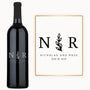 Custom wine bottle engraved with initials N R, olive branch motif, and Nicholas & Rose, July 18, 2026.