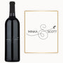 Custom wine bottle and card featuring “Minka & Scott” engraved with an ampersand and leaf design.