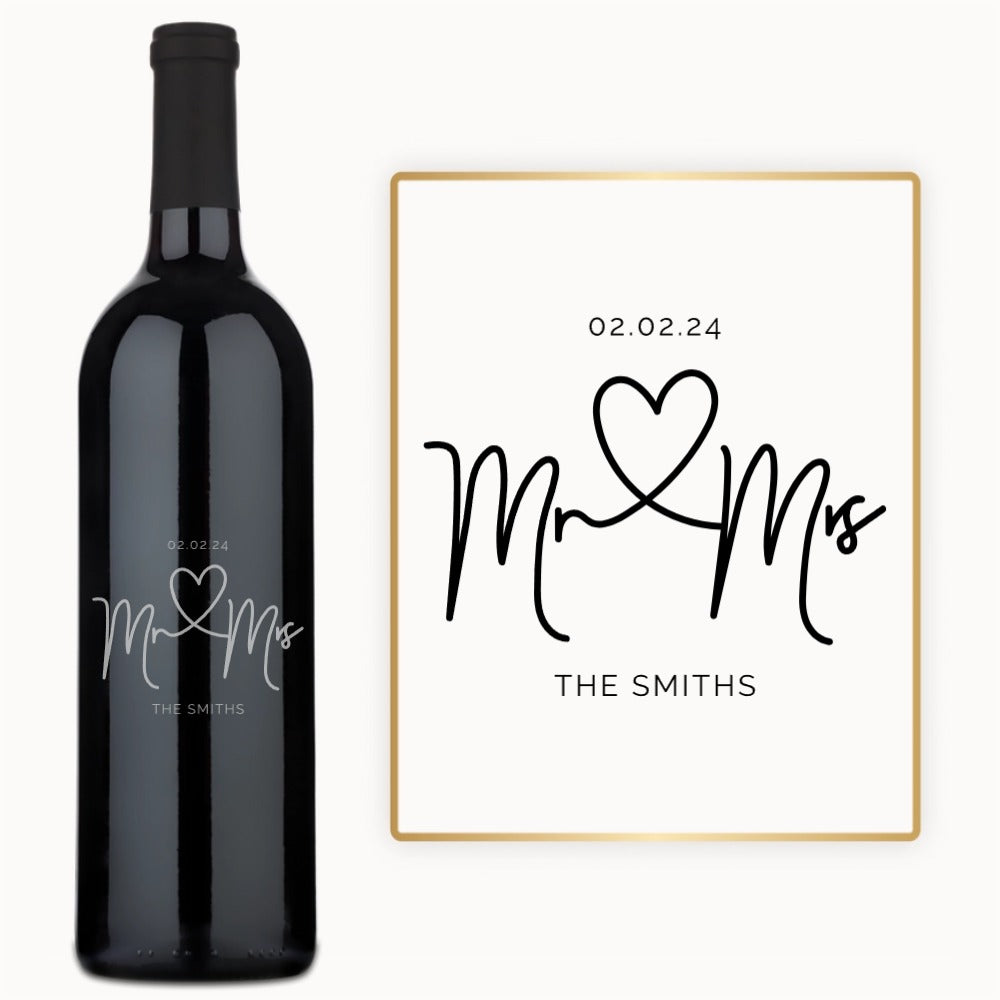 Bottle of wine with Mr. & Mrs. and a heart engraved, plus customizable date and name in black on a white label.