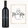 Bottle of wine with Mr. & Mrs. and a heart engraved, plus customizable date and name in black on a white label.