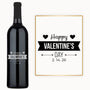 A wine bottle engraved with 2.14.26 and decorated with a heart and arrow design for Valentine’s Day.