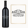 Custom engraved wine bottle featuring a circle crest monogram, displayed on a white background.