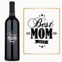 A wine bottle engraved with Best Mom Ever in script, displayed as a Mother’s Day gift.