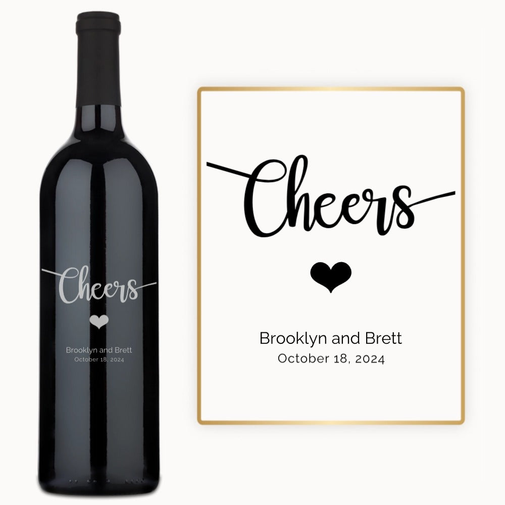 A wine bottle engraved with Cheers, a heart symbol, and custom names with a date on the label.