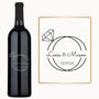 Engraved wine bottle with Lexie & Mason and 12|31|25 in black text, featuring a wedding ring monogram design.