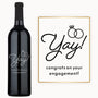 Engraved engagement wine bottle labeled Yay With Rings next to a card reading Yay Congrats on your engagement.