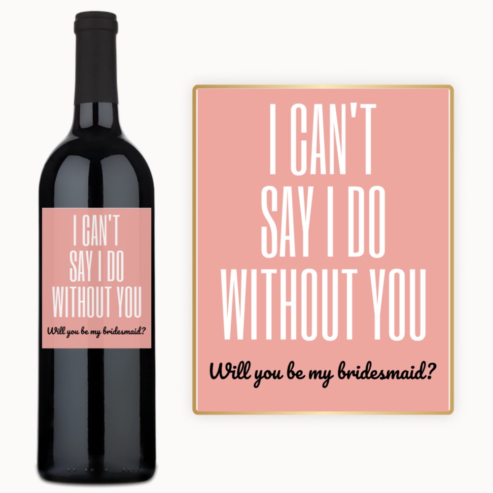 A wine bottle with a custom label reading “Will you be my bridesmaid?” displayed as a personalized gift.