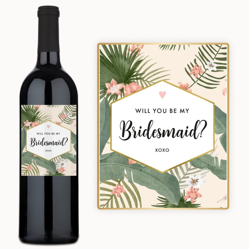 A wine bottle with a custom label featuring tropical designs, intended as a bridesmaid proposal gift.