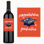 A custom label wine bottle and a graduation card on an orange background.