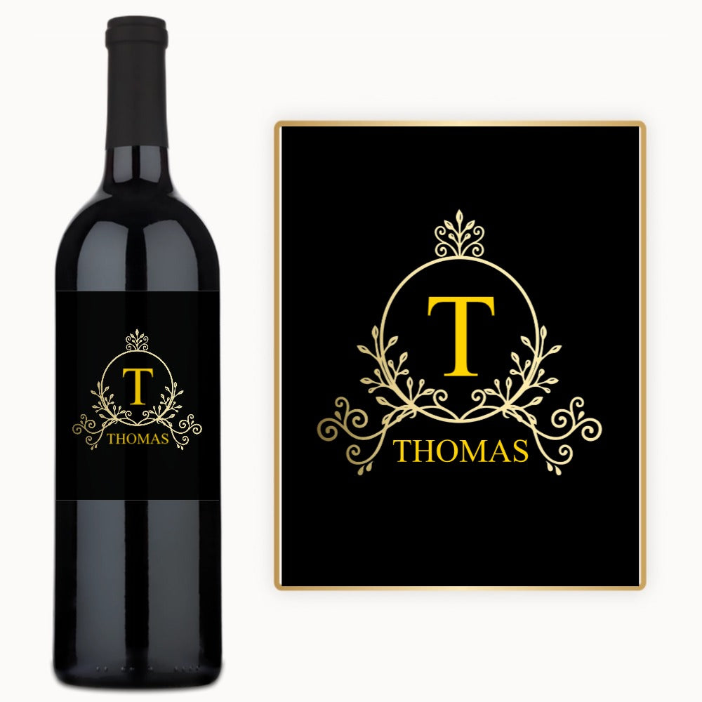 Black wine bottle and plaque labeled Thomas in gold with ornate custom scrollwork design.