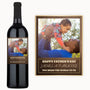 A dad lifts his smiling child on a wine label that reads, Happy Father’s Day, James A. Parsons.