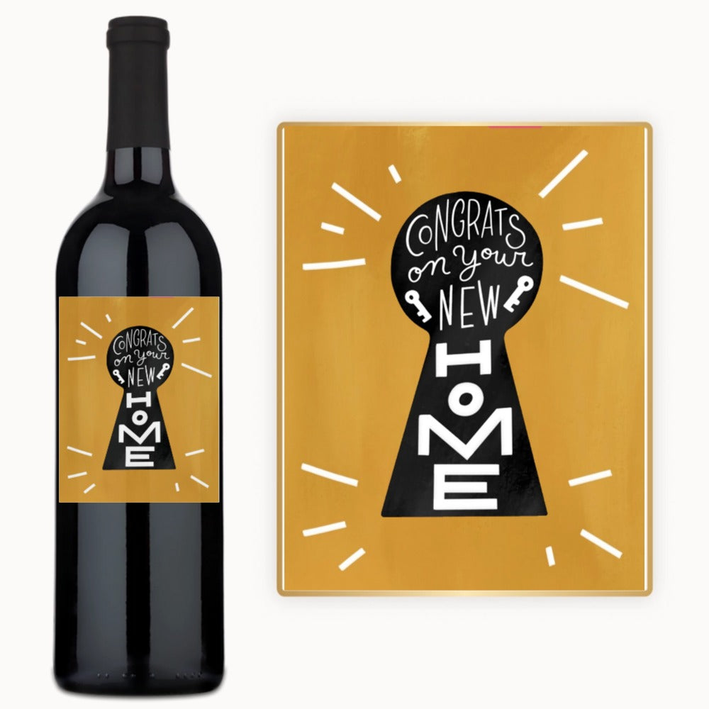 A wine bottle with a custom label featuring a keyhole design and the words New Home.