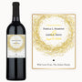 Custom wine bottle with a gold glitter circle label, gold swirls, and an accompanying card for August 12, 2024.
