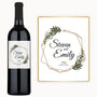 Wine bottle with a floral geometric label reading “Steven and Emily, 4.28.2024.”.