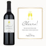 Two wine glasses labeled Cheers clink together beside a custom-labeled wine bottle and a card with clinking glasses.