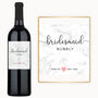 A wine bottle with a custom marble label reading Pop to ♥ say yes, ideal for bridal gifting.