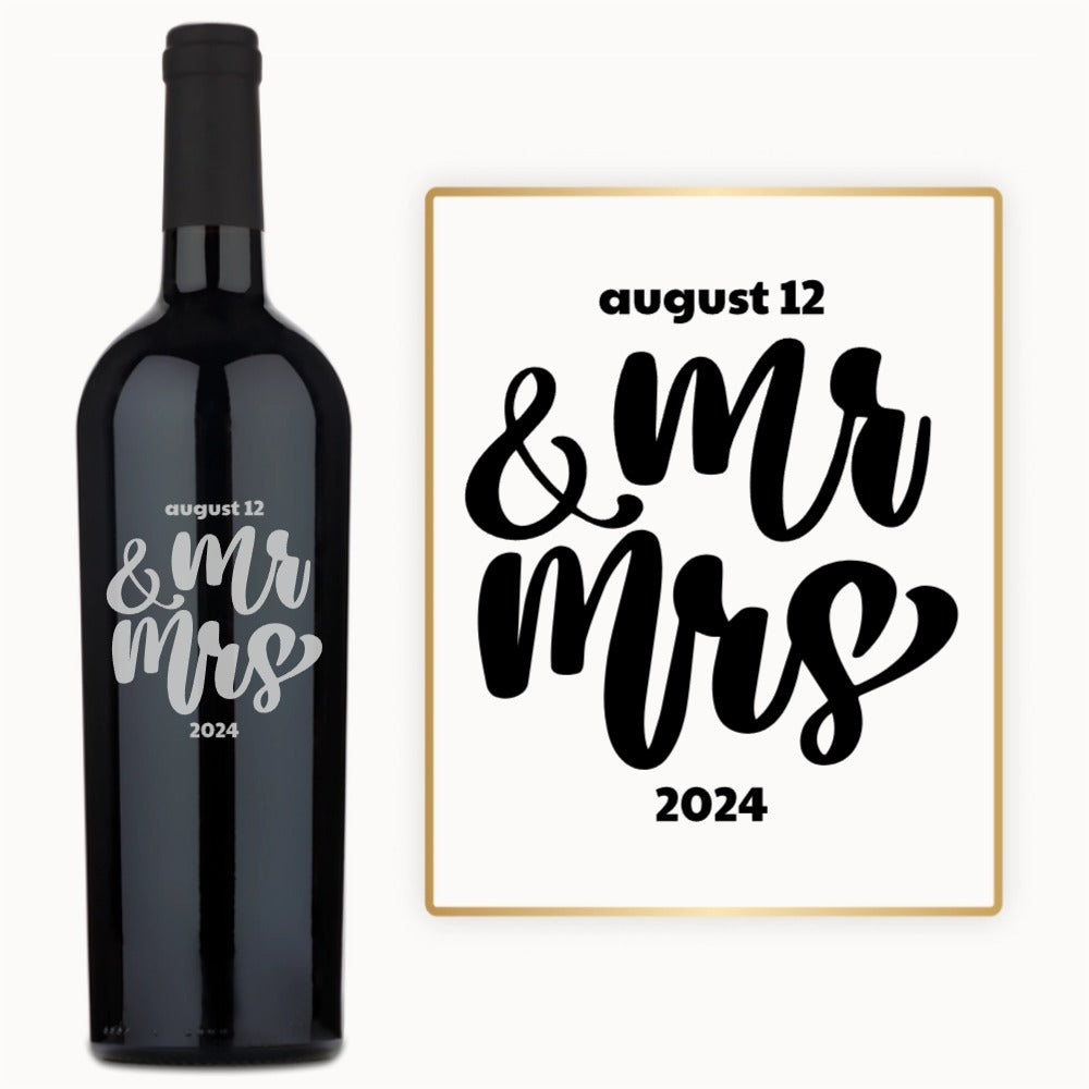 Custom wine bottle engraved with Mr & Mrs in bold script and the date August 12, 2024.
