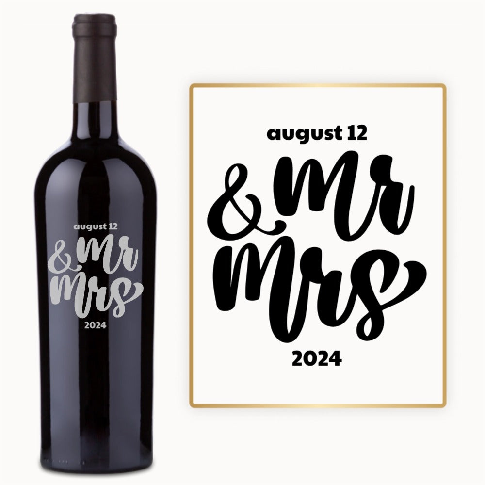 A wine bottle engraved in bold script with August 12 & Mr Mrs 2024 in black and silver.
