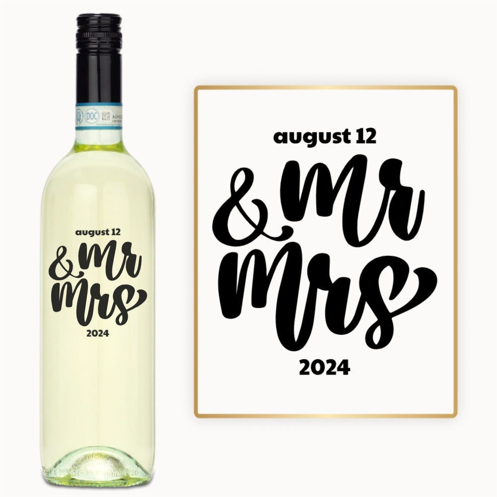 Custom engraved wine bottle and sign with “August 12 & Mr Mrs 2024” in bold black script.