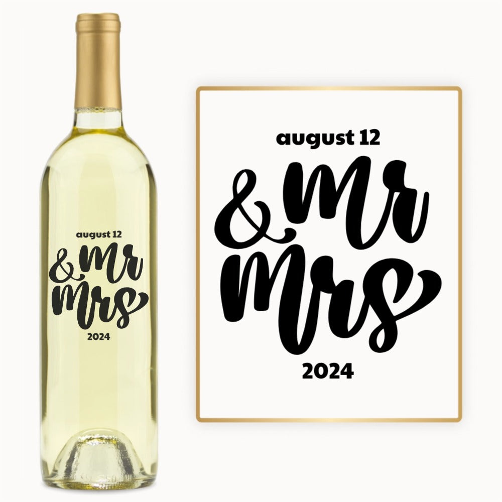 A wine bottle engraved with Mr & Mrs in bold script and August 12, 2024 in black on a white label.