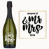 A wine bottle with Mr & Mrs in bold script engraved on the label.