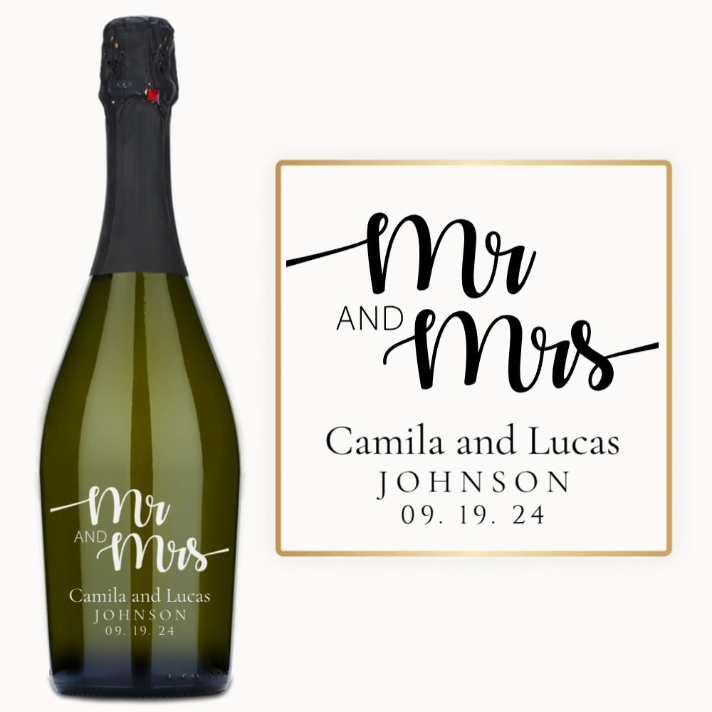 Engraved wine bottle labeled Mr & Mrs Camila & Lucas Johnson 09.19.24 next to a wedding sign.