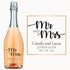 A bottle of wine engraved with Mr & Mrs Camila & Lucas Johnson 09.19.24 in elegant script, displayed as a gift.