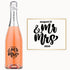 Engraved wine bottle with Mr & Mrs, August 12, and 2024 beside a matching sign displaying the same text.