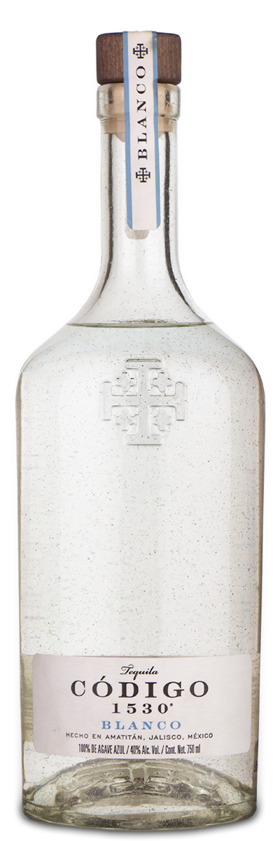 A glass bottle of Codigo 1530 Blanco Tequila with a white and blue label and a wooden cap.
