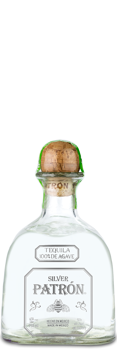 A clear glass bottle of Patrón Silver Tequila featuring a wooden cork and a custom engraved front label.