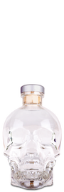Clear skull-shaped bottle with a silver cap on a white background